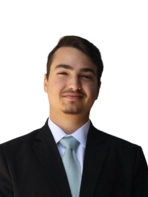 Young man with facial hair in suit and tie