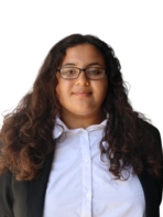 Young woman in business attire with glasses and long curly hair