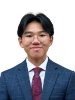 Young man with glasses in suit and tie